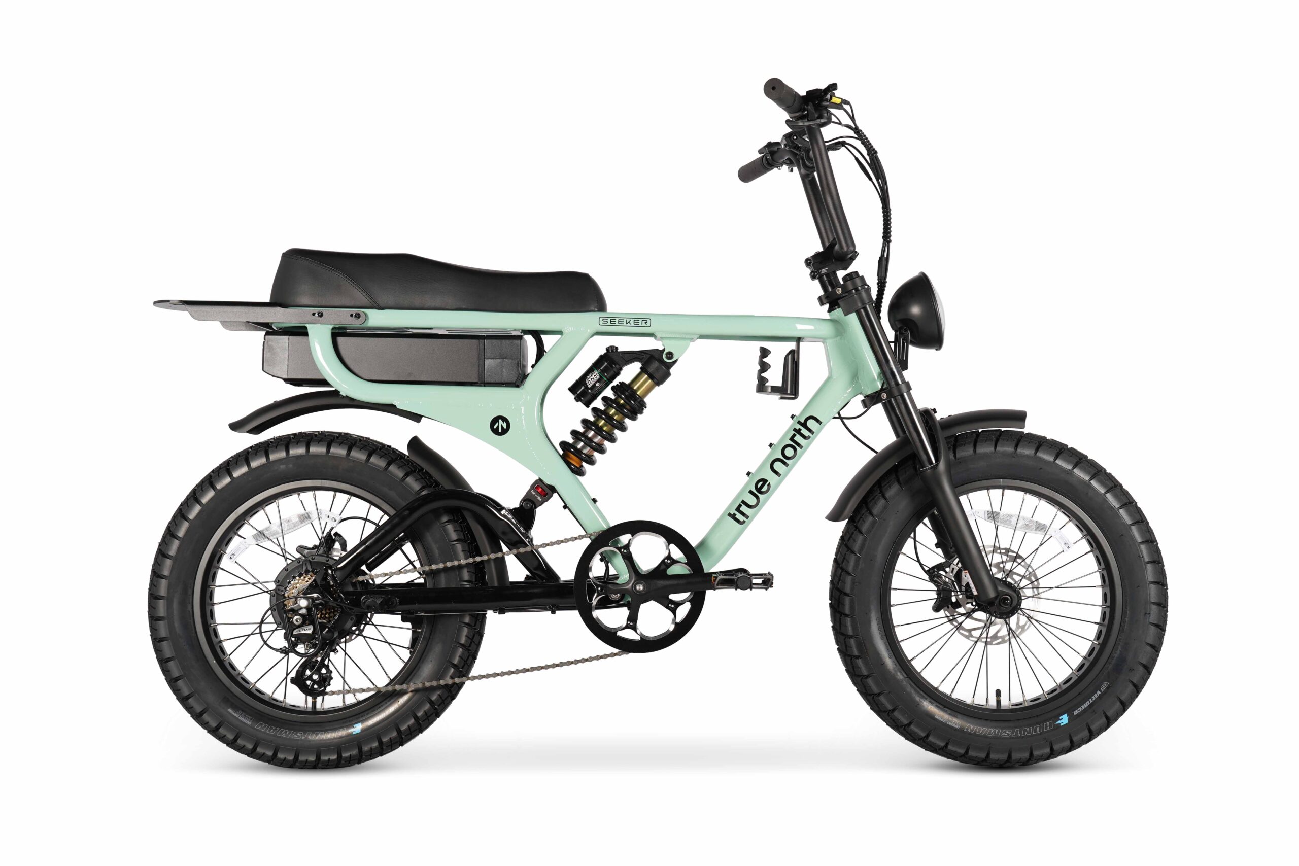 Side view of the Seeker E-Bike in green with fat tyres and integrated battery.